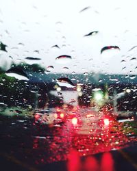 Close-up of wet car window in rainy season