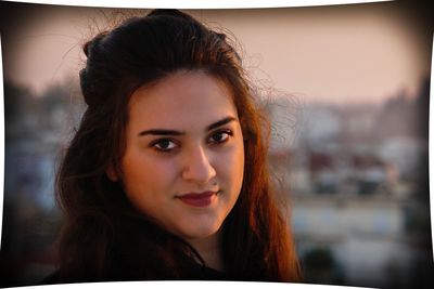 Close-up portrait of a smiling young woman