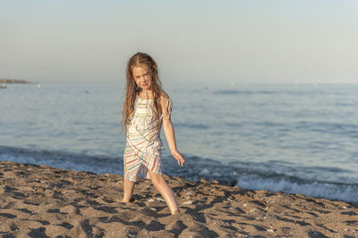 Full length of girl on beach