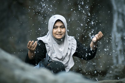 Full length of woman in snow during rainy season