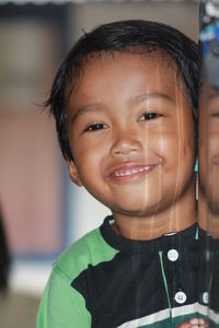 Close-up portrait of smiling boy