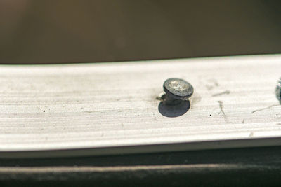 Close-up of metal on table
