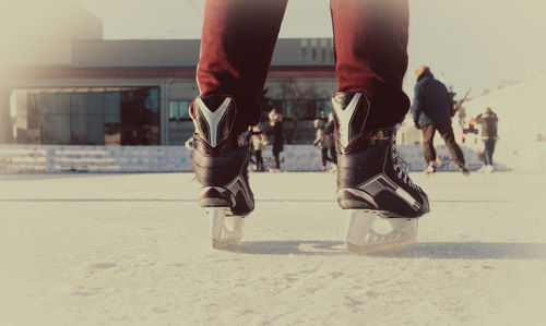 Low section of person ice skating