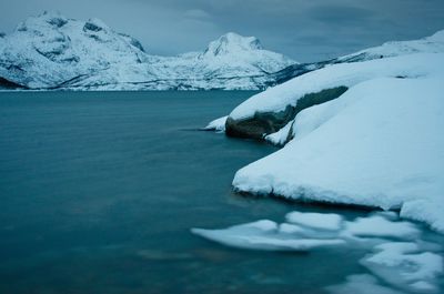 Scenic view of frozen lake against sky