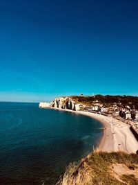 Scenic view of sea against clear blue sky