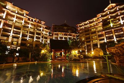 Buildings in city at night