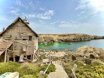 Scenic view of sea and buildings against sky