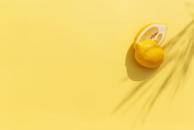 Close-up of yellow fruit against orange background