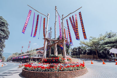 Low angle view of flags against clear sky