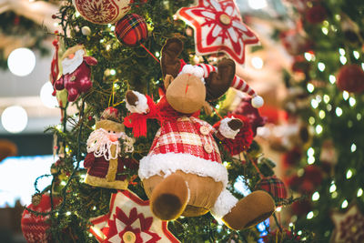Christmas decorations hanging on tree