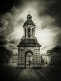 Building exterior against cloudy sky