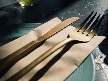 Close-up of fork and table knife on plate