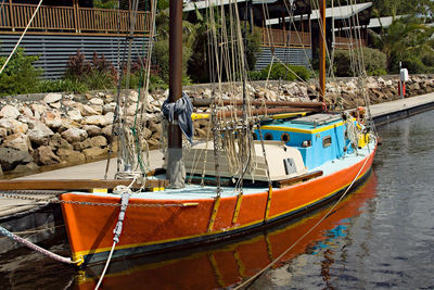 Fishing boats moored at harbor