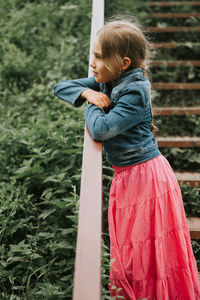 Thoughtful candid kid girl enjoying nature. prepubertal age children mind psychology mental health