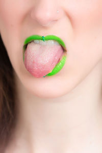 Cropped image of woman with green lipstick