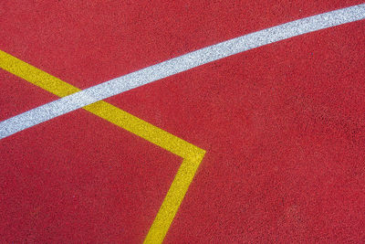 Colorful sports court background. top view to red and blue field rubber ground with  lines outdoors