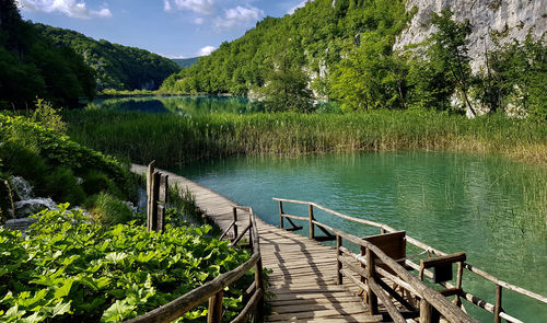 Wooden footbridge over lake plitvice blue in croatia