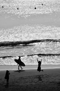 Silhouette people at beach