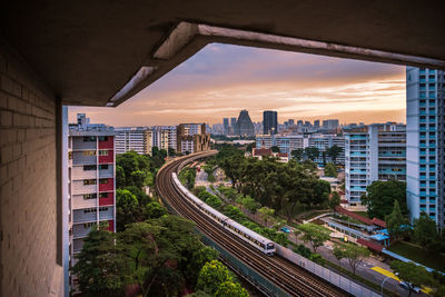 High angle view of buildings in city against sky