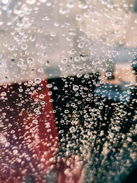 Full frame shot of wet glass window in rainy season