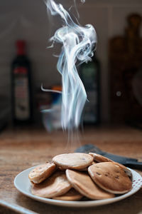 Close-up of cookies in plate on table