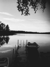 Pier on lake against sky