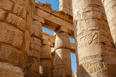 Different hieroglyphs on the walls and columns in the karnak temple.