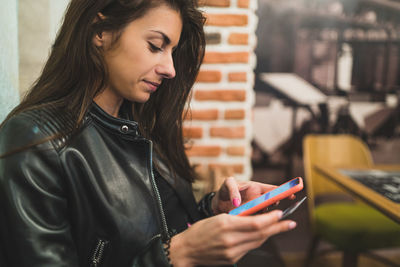 Young woman using mobile phone