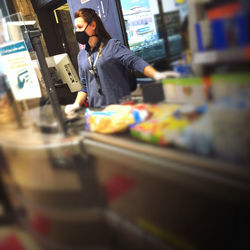 Full length of man looking at store