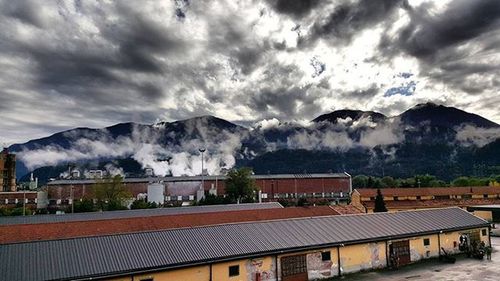 Scenic view of mountains against cloudy sky