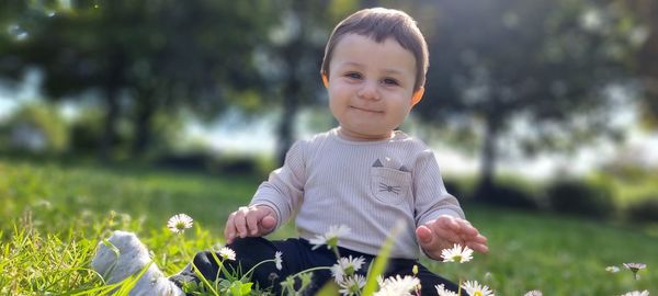 Portrait of cute boy on field