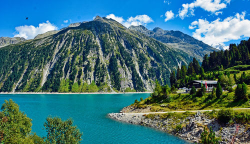 Scenic view of lake and mountains against sky