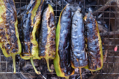 High angle view of fish on barbecue grill