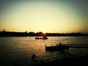 Scenic view of river at sunset