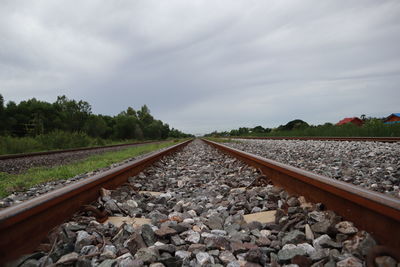 Surface level of railroad track against sky