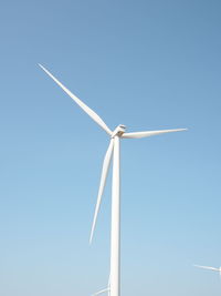 Low angle view of wind turbine against sky