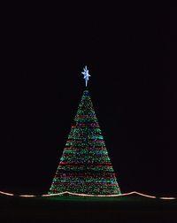 Low angle view of illuminated lights at night