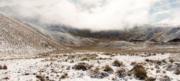 Scenic view of mountains against sky during winter