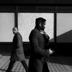 Man looking through window