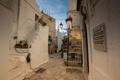 Alley amidst buildings in city