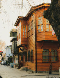 Residential buildings in city against sky