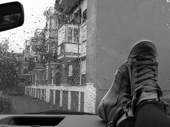 Close-up of shoes by window