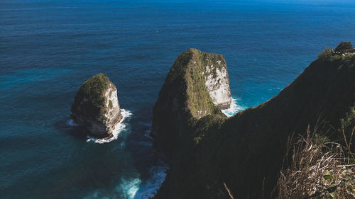 High angle view of rocks in sea