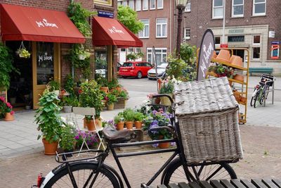 Bicycles on street against buildings in city