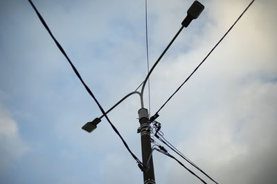 Low angle view of street light against sky