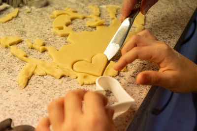 Midsection of person preparing food