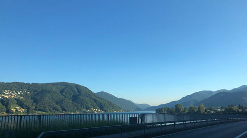 Scenic view of dam against clear blue sky