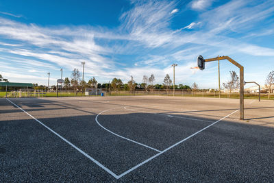Empty basketball court on a summer morning