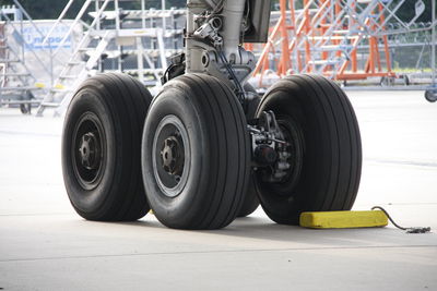 Close-up of airplane tires at runway