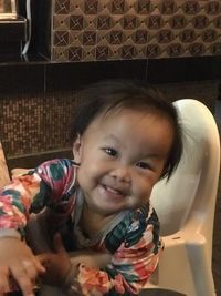 Portrait of smiling boy at home